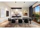Modern dining room boasting stylish pendant lights, an accent rug and natural light at 11240 E Apache Vistas Dr, Scottsdale, AZ 85262