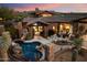 Home exterior featuring a pool, patio area, and desert landscaping for low maintenance at 11240 E Apache Vistas Dr, Scottsdale, AZ 85262