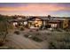 Home exterior featuring a covered patio, desert landscaping, and low-maintenance yard at 11240 E Apache Vistas Dr, Scottsdale, AZ 85262