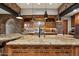 Gourmet kitchen with granite countertops, wood cabinetry, and modern appliances creating an inviting culinary space at 11240 E Apache Vistas Dr, Scottsdale, AZ 85262