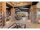 Open concept living room with stone accents, high ceilings, and seamless indoor-outdoor flow at 11240 E Apache Vistas Dr, Scottsdale, AZ 85262