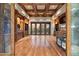 Expansive living room with wood ceiling, built-ins, and outdoor access at 11240 E Apache Vistas Dr, Scottsdale, AZ 85262