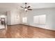 Living room features hardwood floors, high ceilings, and lots of natural light from the windows at 11243 E Jenan Dr, Scottsdale, AZ 85259