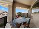 Spacious balcony with wrought iron table and chairs, perfect for outdoor dining and relaxation at 11640 N Tatum Blvd # 3091, Phoenix, AZ 85028