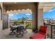 Relaxing outdoor patio with views, a ceiling and wrought iron table with comfortable seating and red chaise lounge at 11640 N Tatum Blvd # 3091, Phoenix, AZ 85028