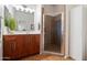 Well-lit bathroom with a glass-enclosed shower and spacious vanity with ample storage at 11640 N Tatum Blvd # 3091, Phoenix, AZ 85028