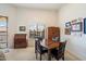 Bright dining area featuring a wooden table, chairs, and a large window for natural light at 11640 N Tatum Blvd # 3091, Phoenix, AZ 85028