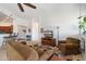 Comfortable living room with a sofa, armchairs, and modern entertainment center at 11640 N Tatum Blvd # 3091, Phoenix, AZ 85028