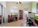 Functional office space with a window view, shelving, rolling chair and two computer monitors at 11640 N Tatum Blvd # 3091, Phoenix, AZ 85028