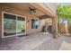 Back porch with tiled flooring, patio area with desert plants and trees at 11752 N 135Th Pl, Scottsdale, AZ 85259