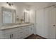 Bathroom featuring double sinks, granite counters and generous cabinet space at 11752 N 135Th Pl, Scottsdale, AZ 85259
