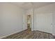 Bedroom featuring wood floors, closet and access to bathroom at 11752 N 135Th Pl, Scottsdale, AZ 85259