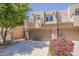 South Scottsdale two-story townhome with a two-car garage, balcony, desert landscaping and block construction at 11752 N 135Th Pl, Scottsdale, AZ 85259
