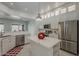 White kitchen with stainless steel appliances and island at 11752 N 135Th Pl, Scottsdale, AZ 85259