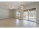 Bright living room with tile flooring, white walls and patio doors with views at 11752 N 135Th Pl, Scottsdale, AZ 85259