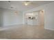 Open-concept living room with tile flooring, white walls and white trim at 11752 N 135Th Pl, Scottsdale, AZ 85259
