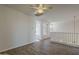 Open loft space with hardwood floors, neutral walls, and a railing overlooking the living area at 11752 N 135Th Pl, Scottsdale, AZ 85259