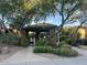 Well-maintained community pool entrance featuring lush landscaping and mature trees, creating a welcoming environment at 11752 N 135Th Pl, Scottsdale, AZ 85259