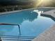 Sparkling community pool featuring a handrail and lounge seating at 11752 N 135Th Pl, Scottsdale, AZ 85259