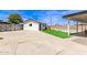 Spacious backyard featuring a covered patio and artificial turf, perfect for enjoying the outdoors at 11842 N 30Th Dr, Phoenix, AZ 85029