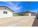 Spacious backyard featuring the house, pool, and plenty of concrete area at 11842 N 30Th Dr, Phoenix, AZ 85029