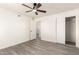Minimalist bedroom with ceiling fan, closet and modern flooring at 11842 N 30Th Dr, Phoenix, AZ 85029