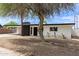 Charming single-story home featuring a xeriscaped yard, carport, and painted brick exterior at 11842 N 30Th Dr, Phoenix, AZ 85029
