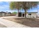 Charming single-story home featuring a xeriscaped yard, carport, and painted brick exterior at 11842 N 30Th Dr, Phoenix, AZ 85029
