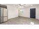 Open-concept living area connected to kitchen, featuring light floors and a modern design at 11842 N 30Th Dr, Phoenix, AZ 85029