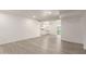 Bright living room with gray-toned flooring and neutral walls; open-concept design and recessed lighting at 11842 N 30Th Dr, Phoenix, AZ 85029
