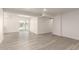 Bright living room with gray-toned flooring and neutral walls; featuring a slider leading to the yard at 11842 N 30Th Dr, Phoenix, AZ 85029