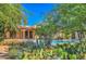 Backyard view showcasing desert plants, pool, covered patio, and home exterior at 12646 N 80Th Pl, Scottsdale, AZ 85260
