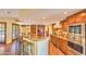 Kitchen featuring granite countertops, an island with seating, tile floors, and modern stainless steel appliances at 12646 N 80Th Pl, Scottsdale, AZ 85260