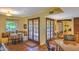 Open kitchen space featuring a breakfast nook with seating, granite countertops, and access to the outdoor patio at 12646 N 80Th Pl, Scottsdale, AZ 85260