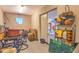 Multipurpose storage room with shelving and sliding door to additional garage storage at 12646 N 80Th Pl, Scottsdale, AZ 85260