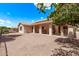 Backyard featuring a covered patio, gravel, and potential for customized landscaping at 14207 W Kiowa Trl, Surprise, AZ 85374