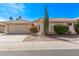 Charming single-story home with desert landscaping, a two-car garage, and a private gated courtyard at 14207 W Kiowa Trl, Surprise, AZ 85374