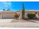 Charming single-story home with desert landscaping, a two-car garage, and a private gated courtyard at 14207 W Kiowa Trl, Surprise, AZ 85374