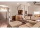 Open floor plan living room with hardwood floors and large front entry at 14207 W Kiowa Trl, Surprise, AZ 85374