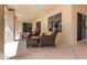Inviting covered patio with comfortable wicker furniture perfect for outdoor entertaining at 14207 W Kiowa Trl, Surprise, AZ 85374