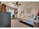 Cozy bedroom featuring a comfortable bed, natural lighting, and stylish decor at 1423 E Breezy Ct, Phoenix, AZ 85086