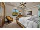 Cozy bedroom with natural light, ceiling fan, and comfortable seating area, perfect for relaxing at 1423 E Breezy Ct, Phoenix, AZ 85086