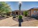 Inviting front yard with desert landscaping, paved walkway, and mature trees at 1423 E Breezy Ct, Phoenix, AZ 85086