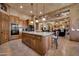 Spacious kitchen featuring wooden cabinets, a granite island, and stainless steel appliances at 1423 E Breezy Ct, Phoenix, AZ 85086