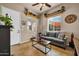 Cozy living room featuring neutral tones, a comfortable sofa, and stylish decor at 1423 E Breezy Ct, Phoenix, AZ 85086