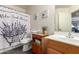 Bathroom with tub, shower curtain, vanity, toilet and decorative lavender decor at 14514 N 128Th Dr, El Mirage, AZ 85335