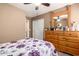 Bedroom featuring updated floors, dresser, and natural light at 14514 N 128Th Dr, El Mirage, AZ 85335
