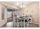 Bright dining area with sliding glass doors leading to the backyard at 14514 N 128Th Dr, El Mirage, AZ 85335