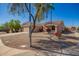 Lovely one-story home with low-maintenance landscaping and mature tree, situated on the corner of an intersection at 14514 N 128Th Dr, El Mirage, AZ 85335