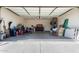 Garage with packed boxes, storage chest, tools and equipment for moving at 14514 N 128Th Dr, El Mirage, AZ 85335